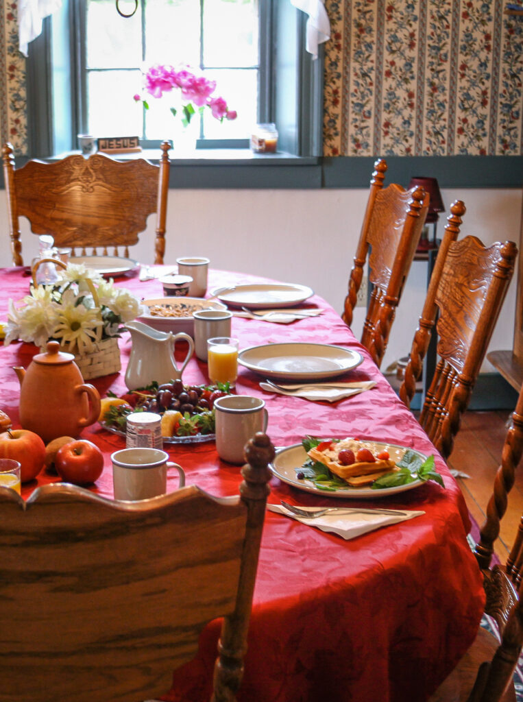 Photo of dining room table with breakfast items on it at Blue Rock Bed and Breakfast