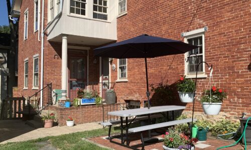 photo of entrance and back of house with picnic table at Blue Rock Bed and Breakfast